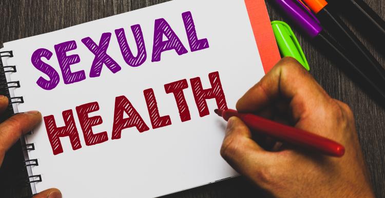 the words 'sexual health' written on paper