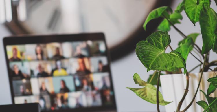 A laptop displaying a group video call