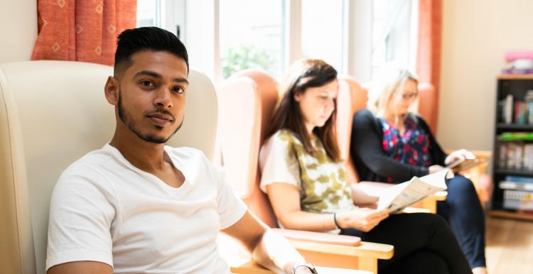 Group of people sitting in the waiting room 