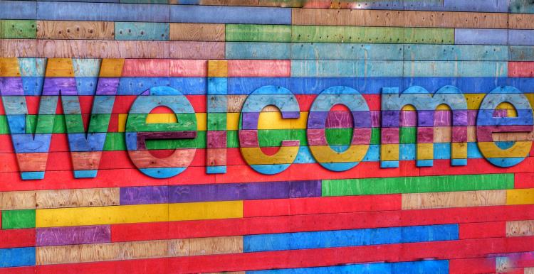 Wooden colourful welcome sign