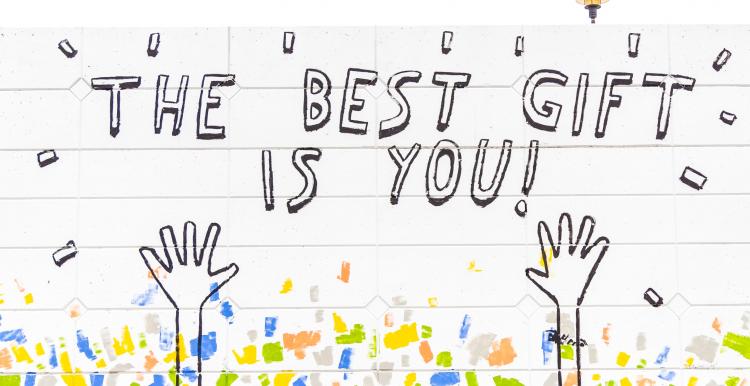 graffiti wall that says the best gift if you