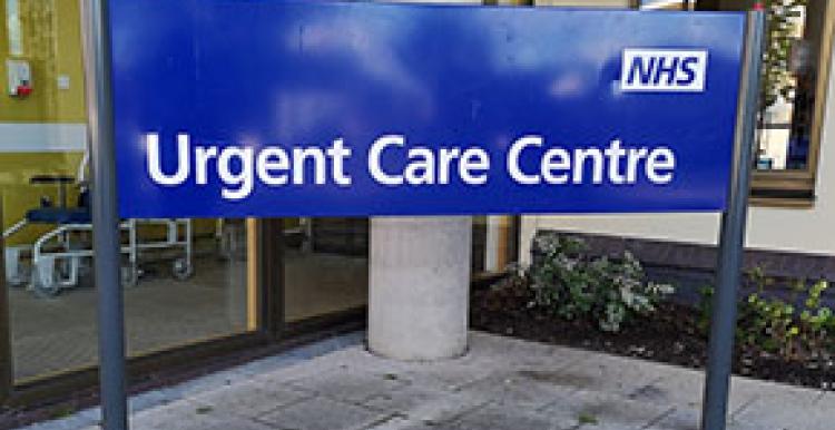 NHS Urgent Care Centre Sign outside building