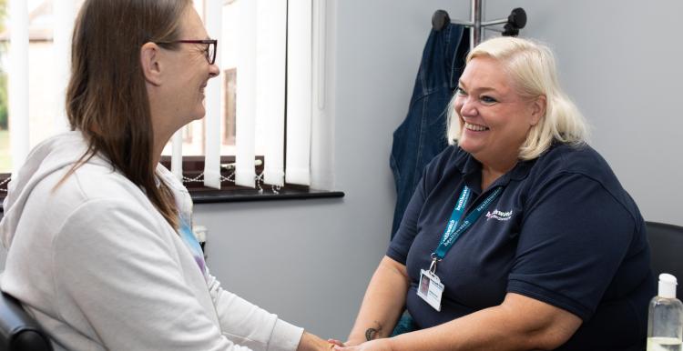 Healthwatch lady talking to a middle-aged woman