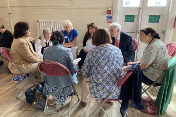 Group of people in discussion at our public REND event.