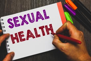the words 'sexual health' written on paper