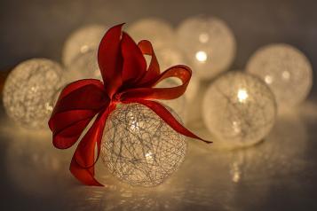 Glass bauble lights with red ribbon