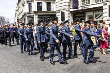 Armed Forces personnel marching through a street in the UK 