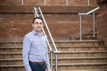 Man standing alone on some steps