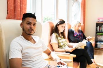 Group of people sitting in the waiting room 