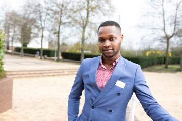 Man standing in a court yard