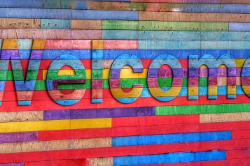 Wooden colourful welcome sign