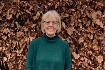 Photo of Meg, one of our volunteers, smiling to camera