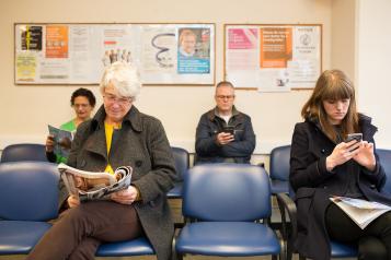 Patients sitting in a GP waiting area