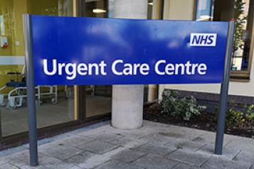 NHS Urgent Care Centre Sign outside building