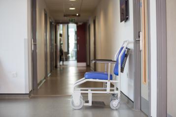 Hospital corridor with empty wheelchair