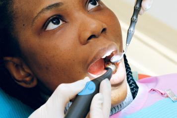 Woman having dental treatment