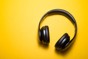 Set of headphones on a yellow background