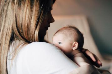 Woman holding a young baby