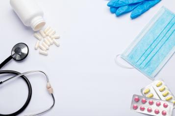 Stethoscope with medication, masks and gloves