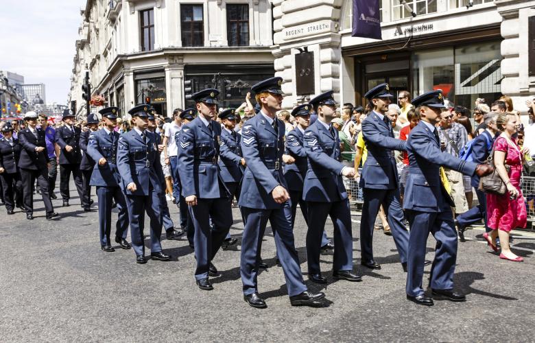 Armed Forces personnel marching through a street in the UK 
