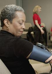 Black woman having blood pressure taken
