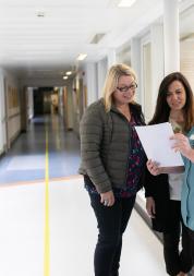 Family members speaking to a hospital worker