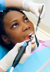 Woman having dental treatment